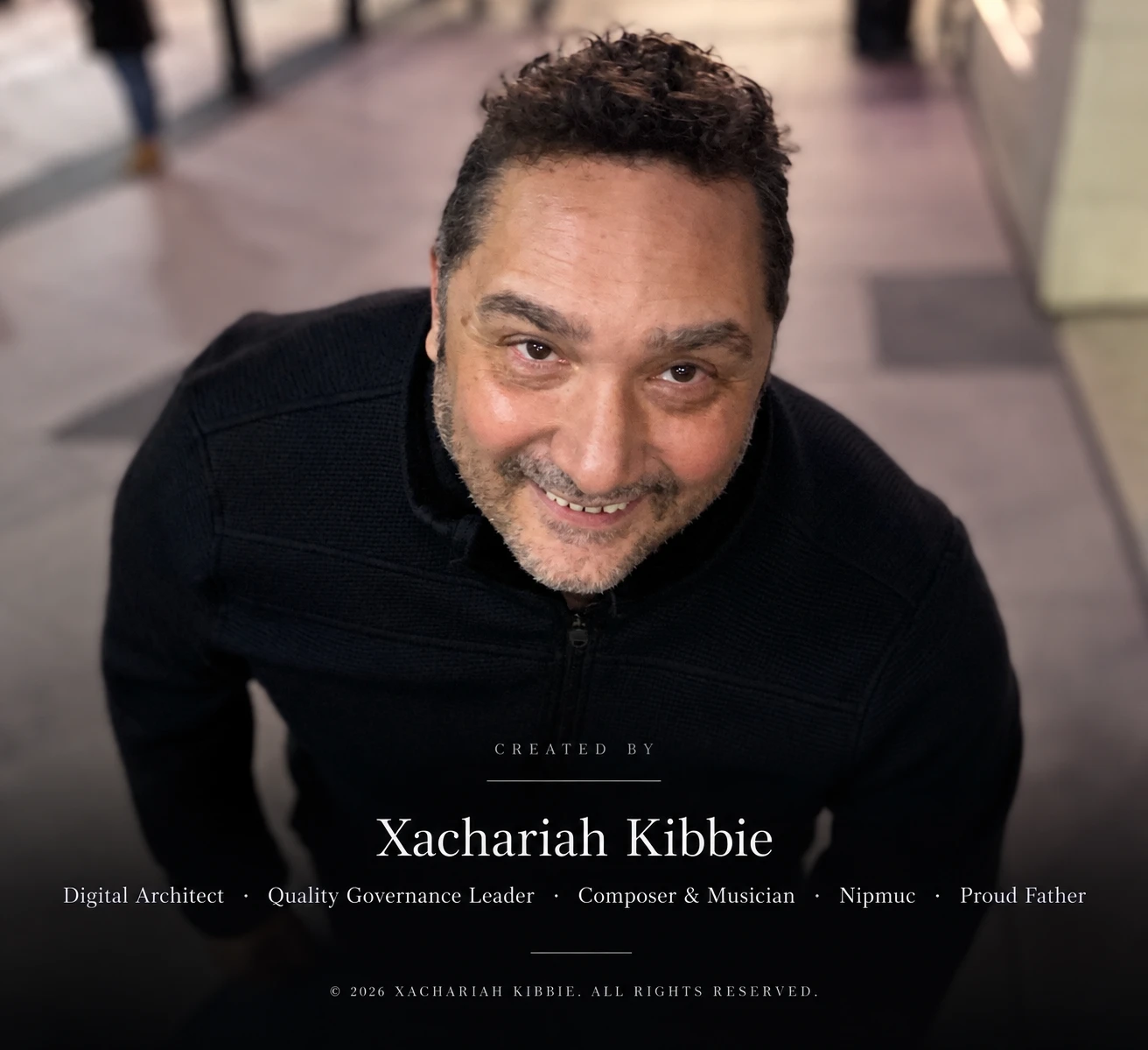Portrait of Xachariah Kibbie with the principal Mercurial World creator colophon embedded in the image.
